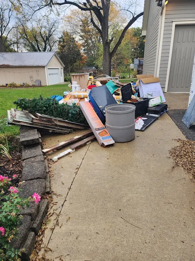 Dumpster being loaded with debris for Residential Dumpster Rental in Fairview